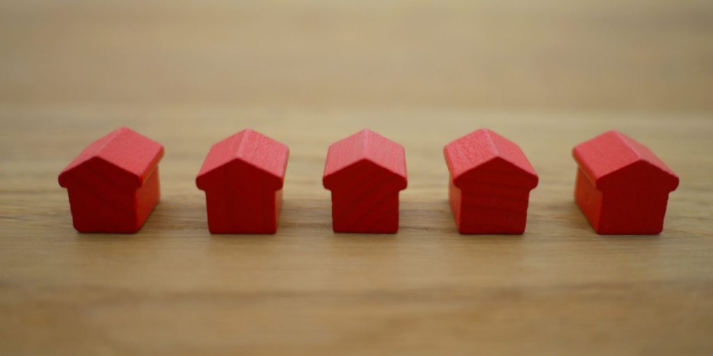 red wooden toy houses