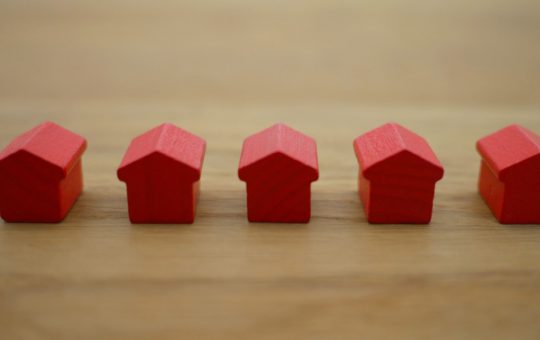 red wooden toy houses